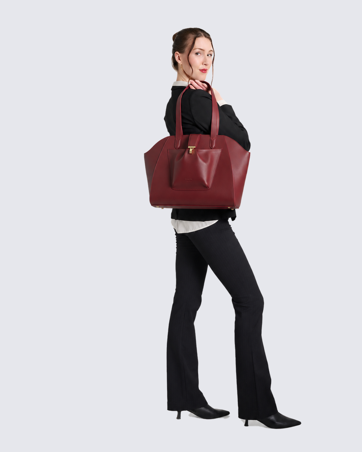 The Fiora Tote in Cherry Red, on the shoulder