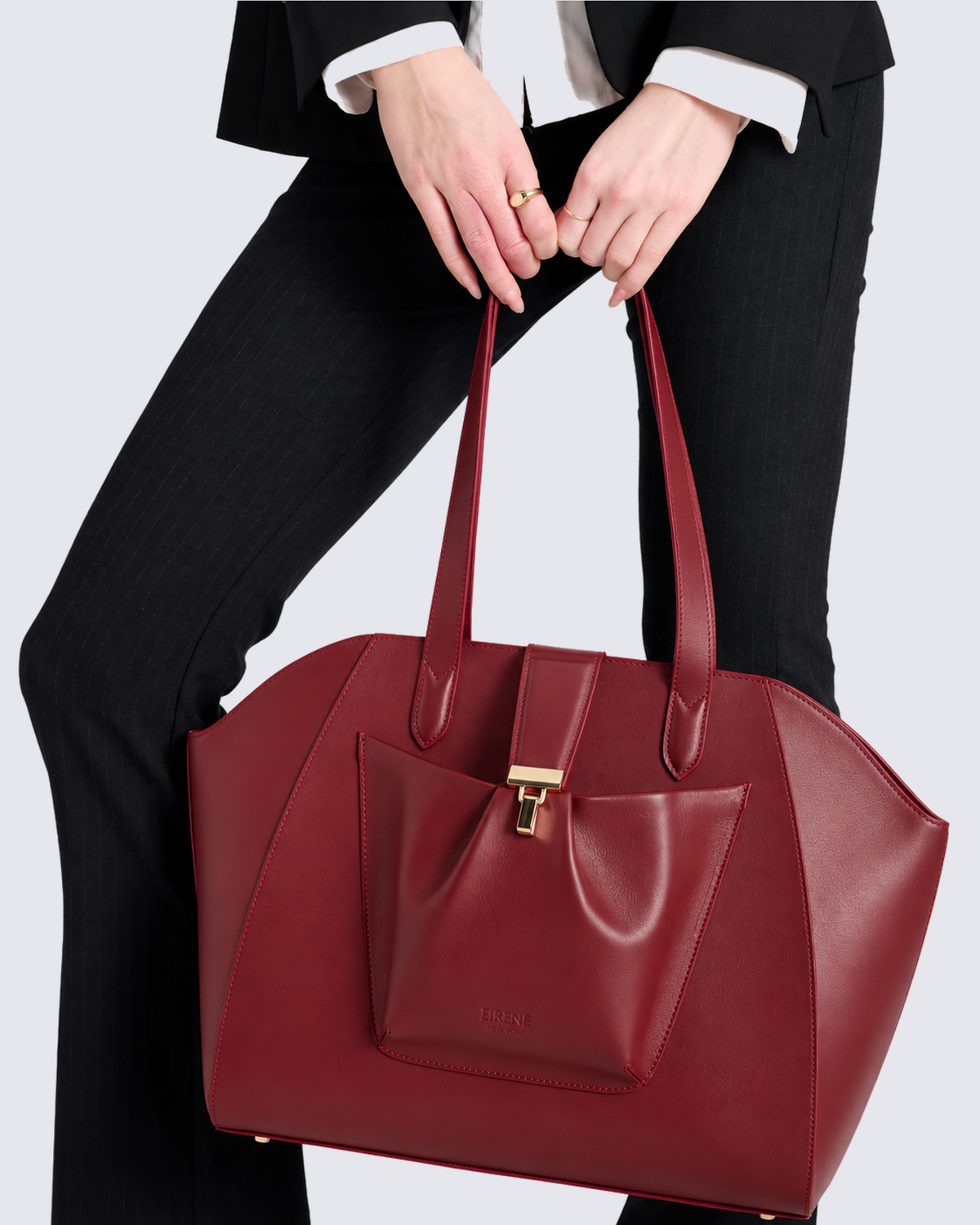 The Fiora Tote in Cherry Red, in hand