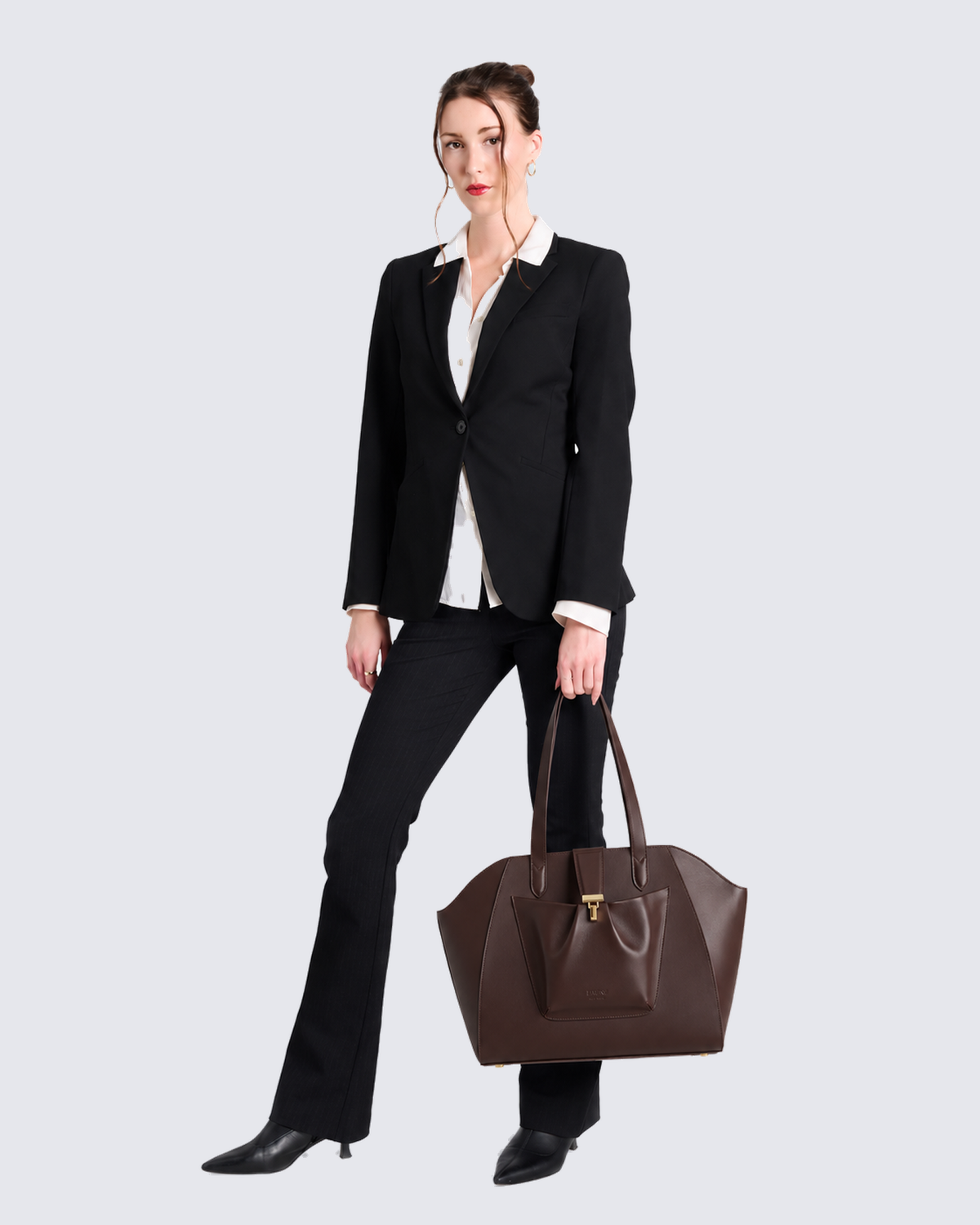 The Fiora Tote in Dark Brown, in hand