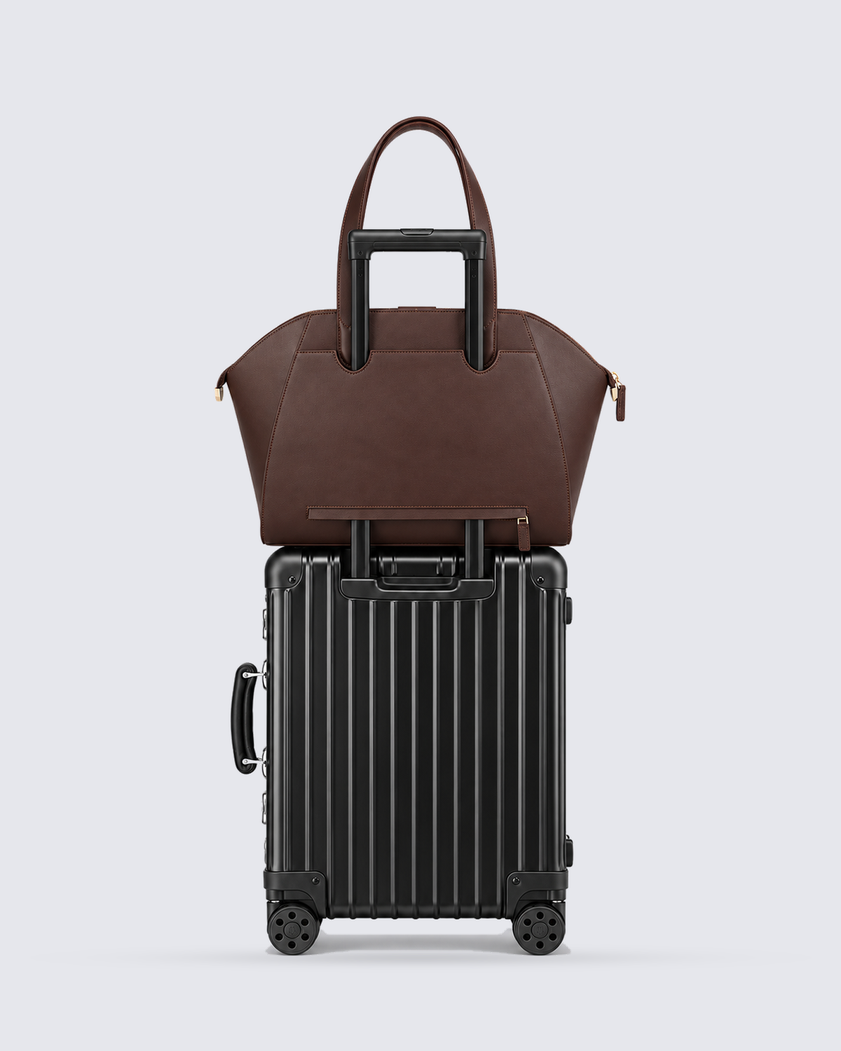 The Fiora Tote Travel Edition in Dark Brown, on a trolley, back