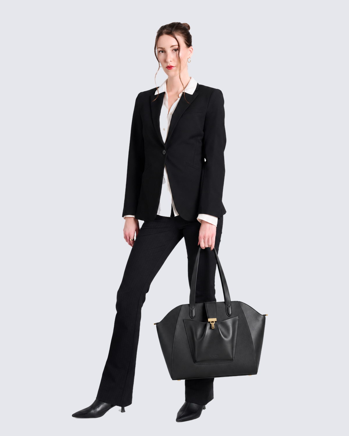 The Fiora Tote Travel Edition in Jet Black, in hand