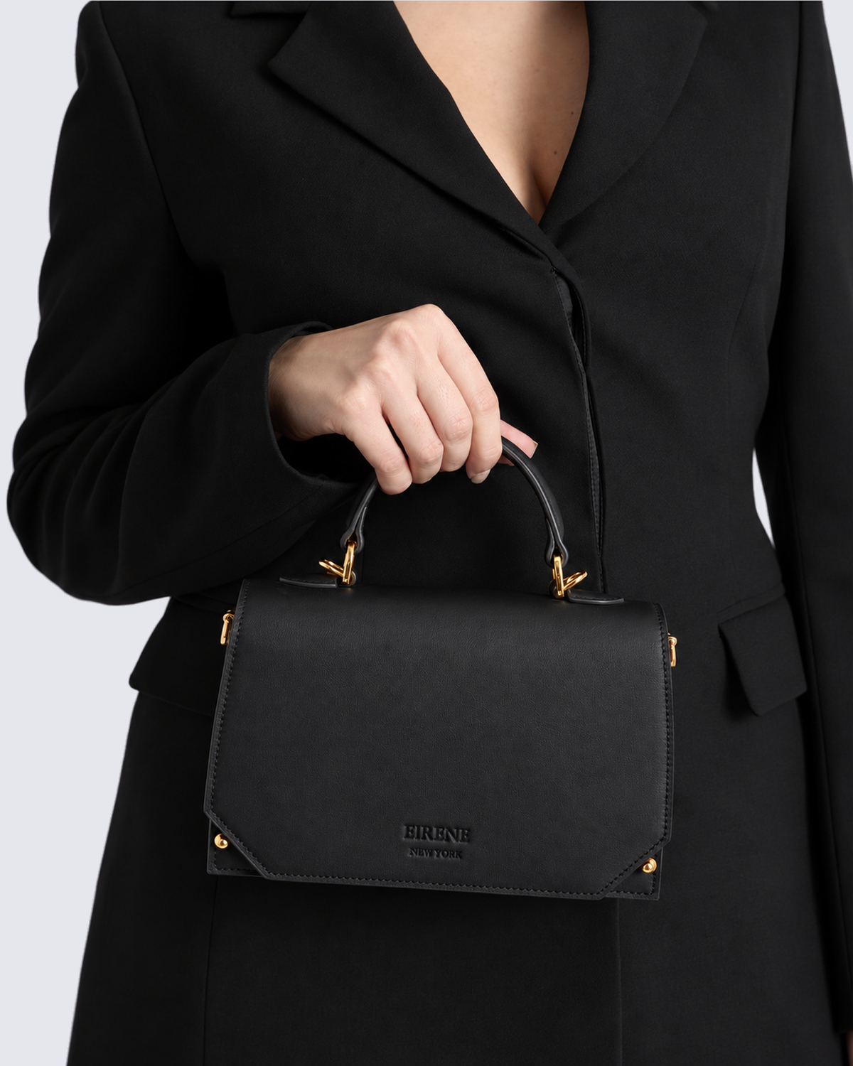 The Siena Mini Purse in Jet Black, in hand