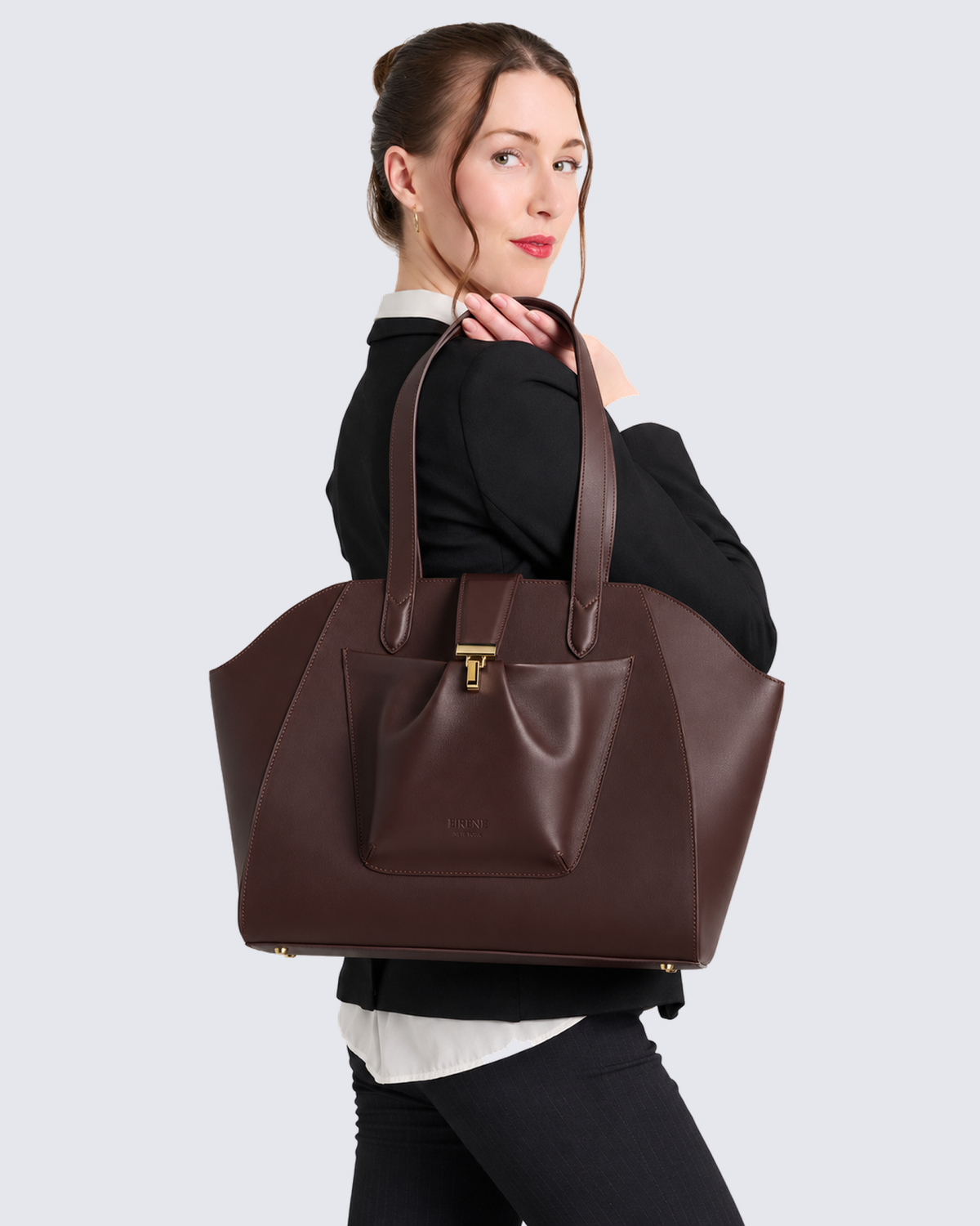 The Fiora Tote in Dark Brown, on the shoulder