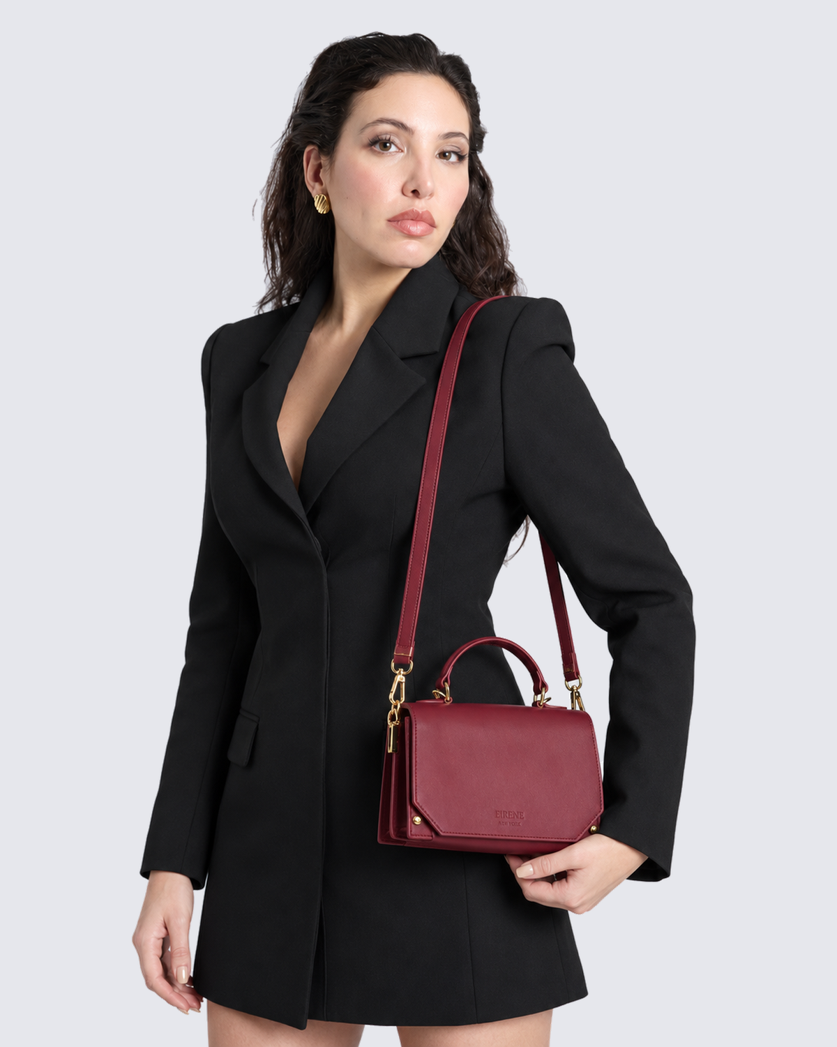 The Siena Mini Purse in Cherry Red, on the shoulder