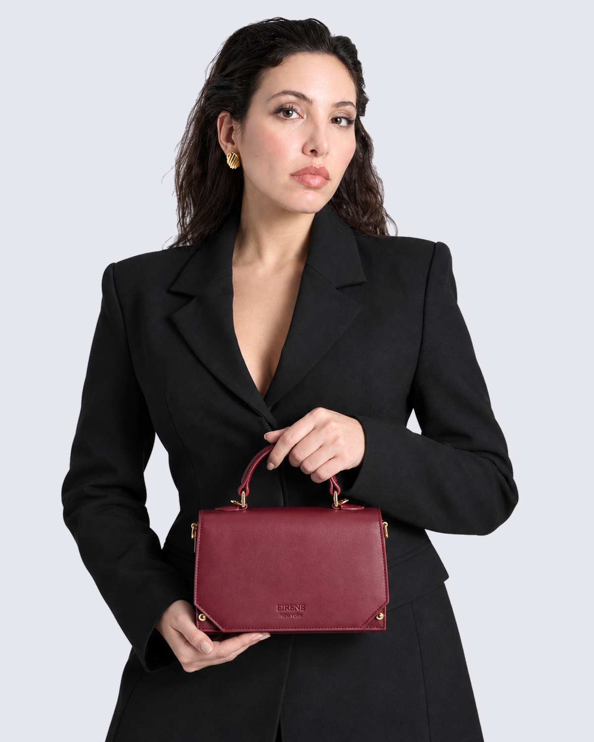 The Siena Mini Purse in Cherry Red, in hand